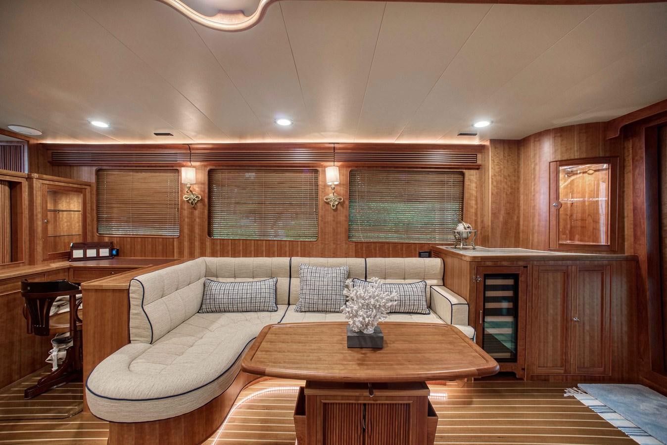 a living room with a couch and a table aboard MAGIC Yacht for Sale