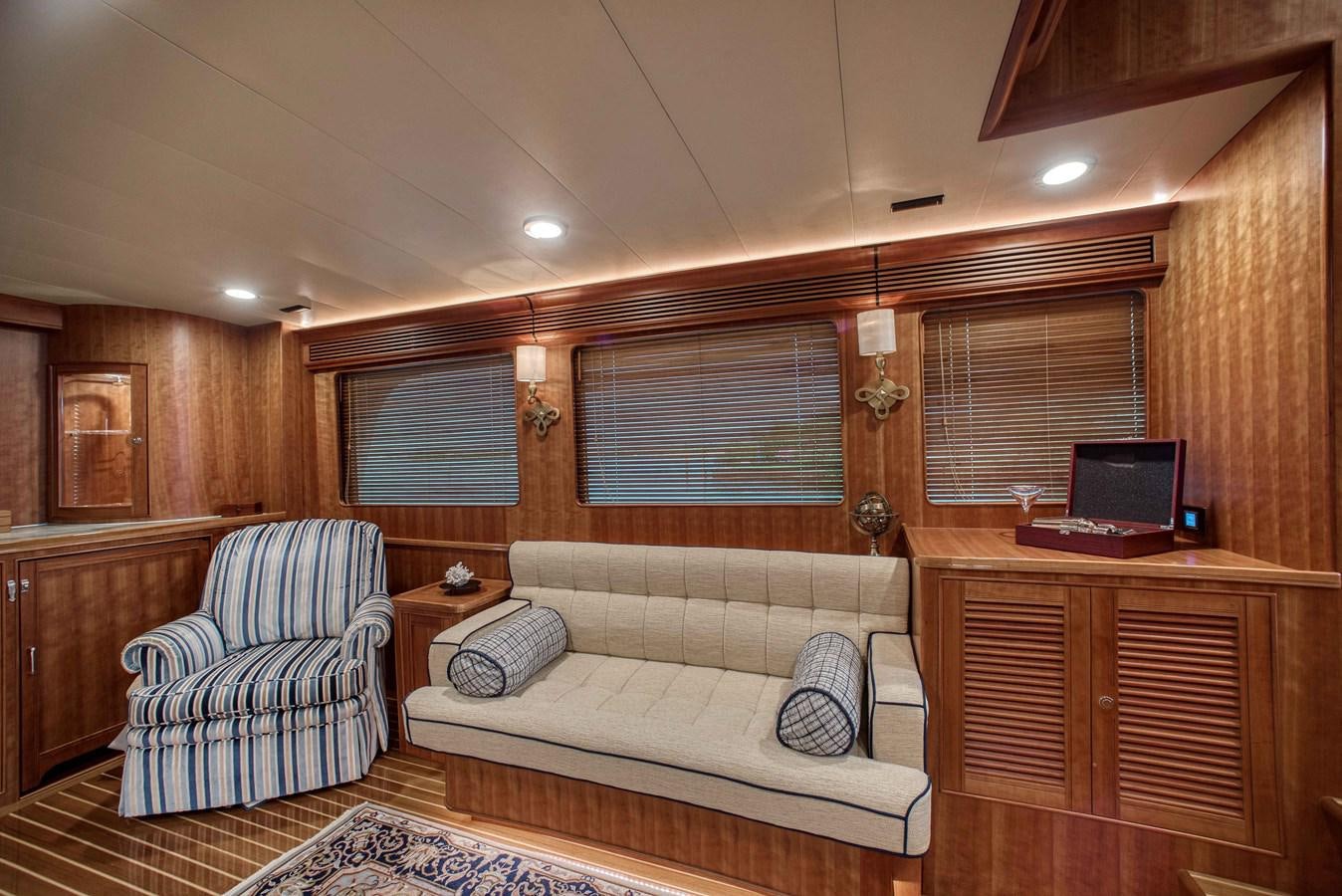 a living room with a couch and a laptop aboard MAGIC Yacht for Sale