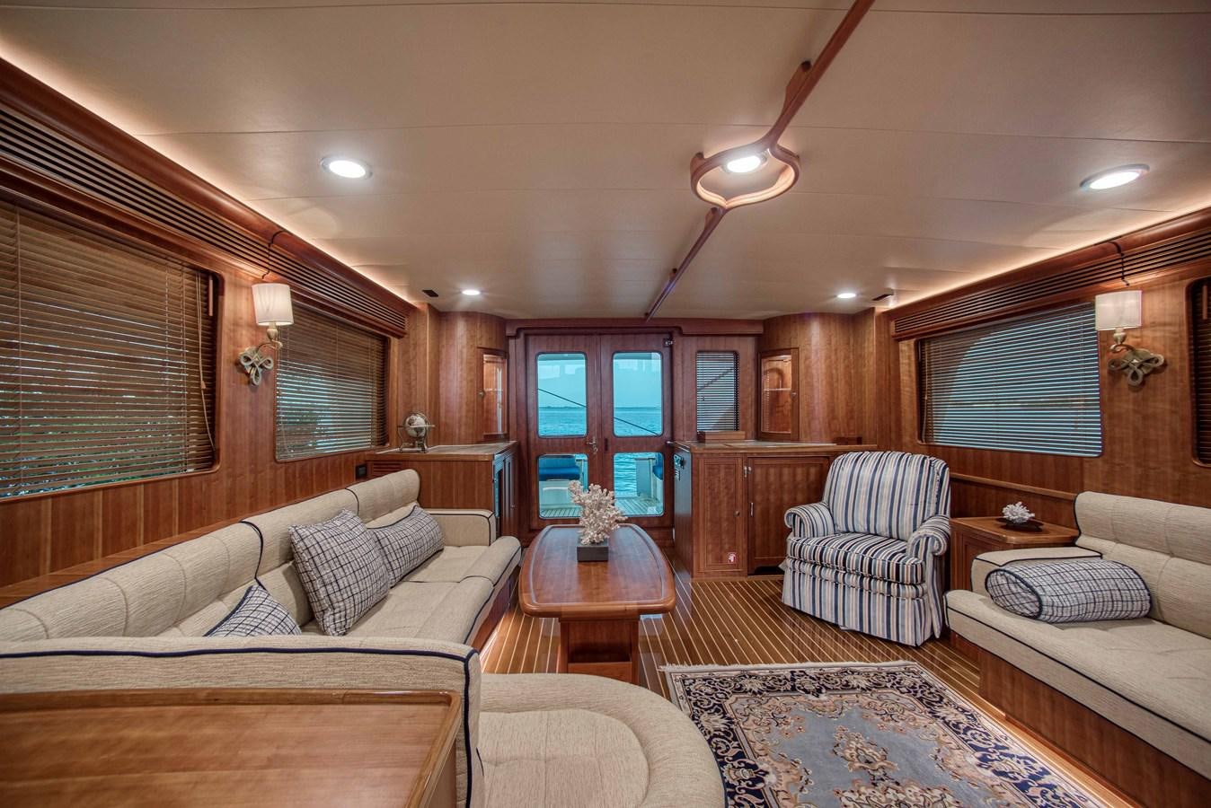 a living room with a couch and a coffee table aboard MAGIC Yacht for Sale