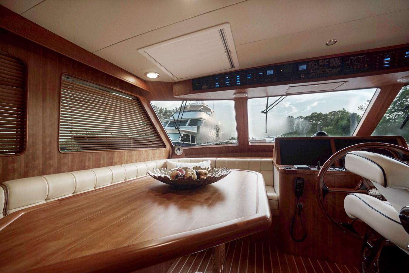 a table with a bowl of fruit on it aboard MAGIC Yacht for Sale