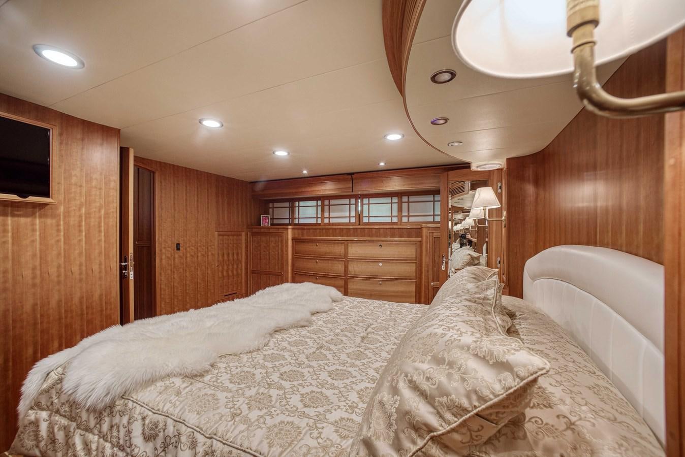 a bedroom with wood walls aboard MAGIC Yacht for Sale