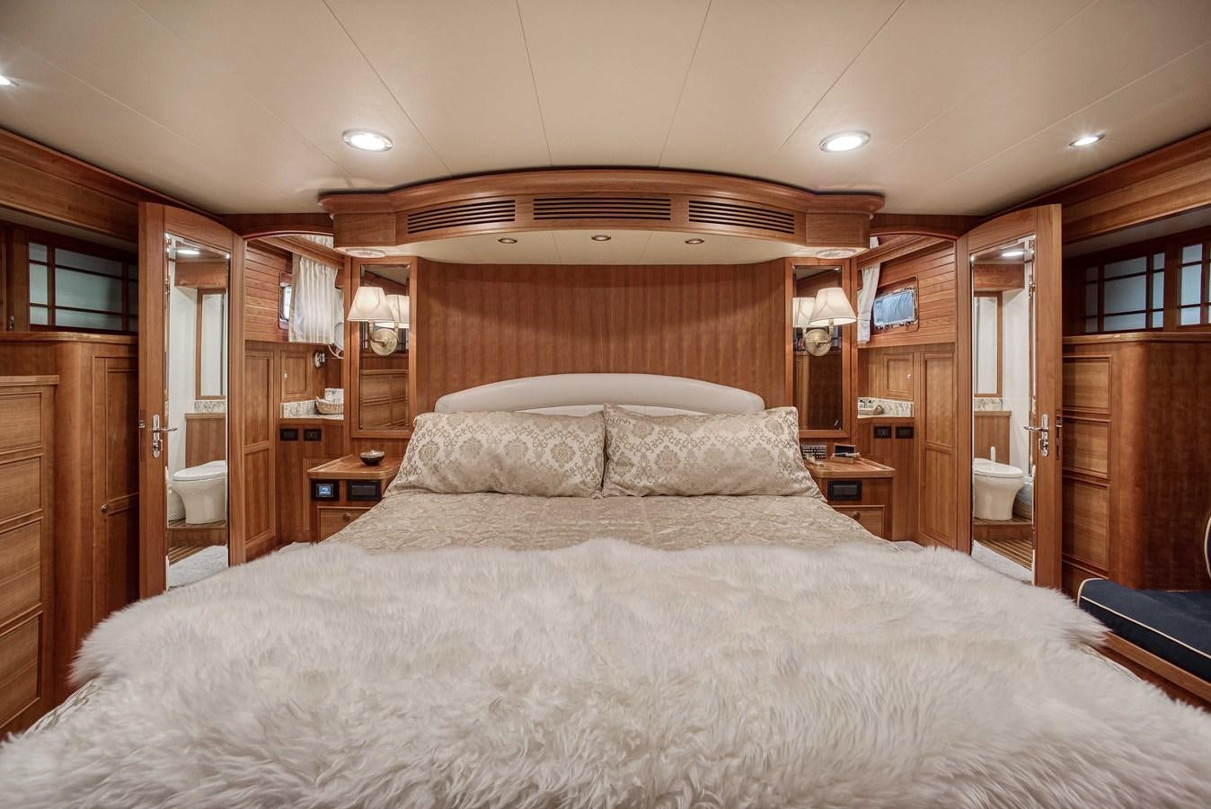 a large bed in a room aboard MAGIC Yacht for Sale