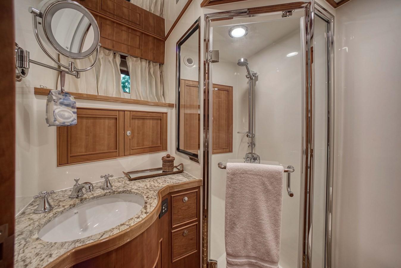 a bathroom with a sink and a mirror aboard MAGIC Yacht for Sale