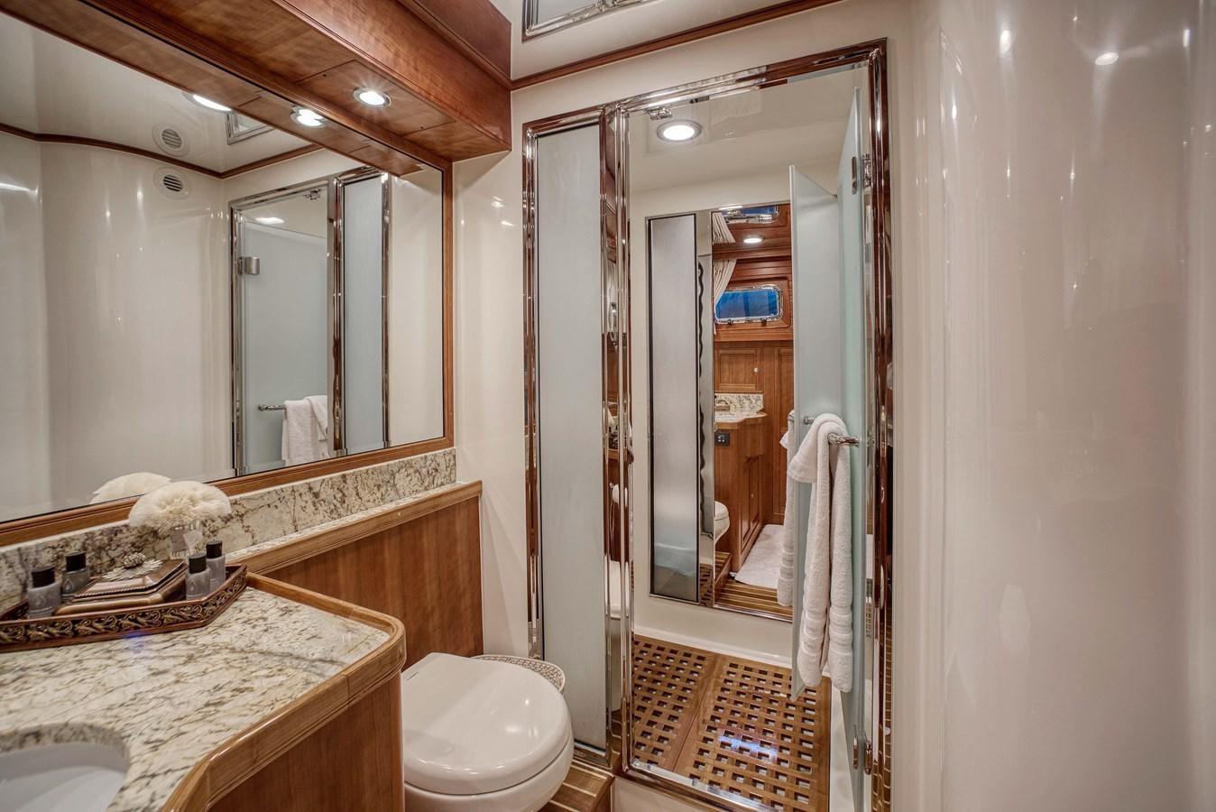 a bathroom with a glass shower aboard MAGIC Yacht for Sale