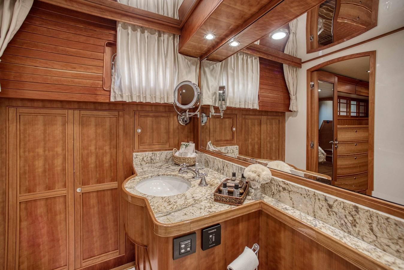 a bathroom with a sink and a mirror aboard MAGIC Yacht for Sale