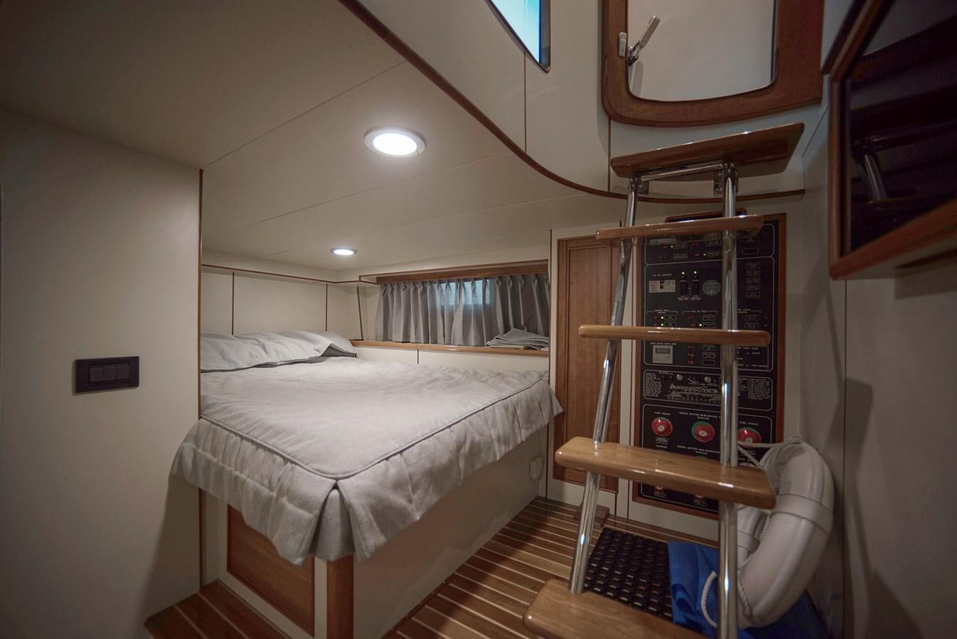 a bunk bed with a ladder aboard MAGIC Yacht for Sale