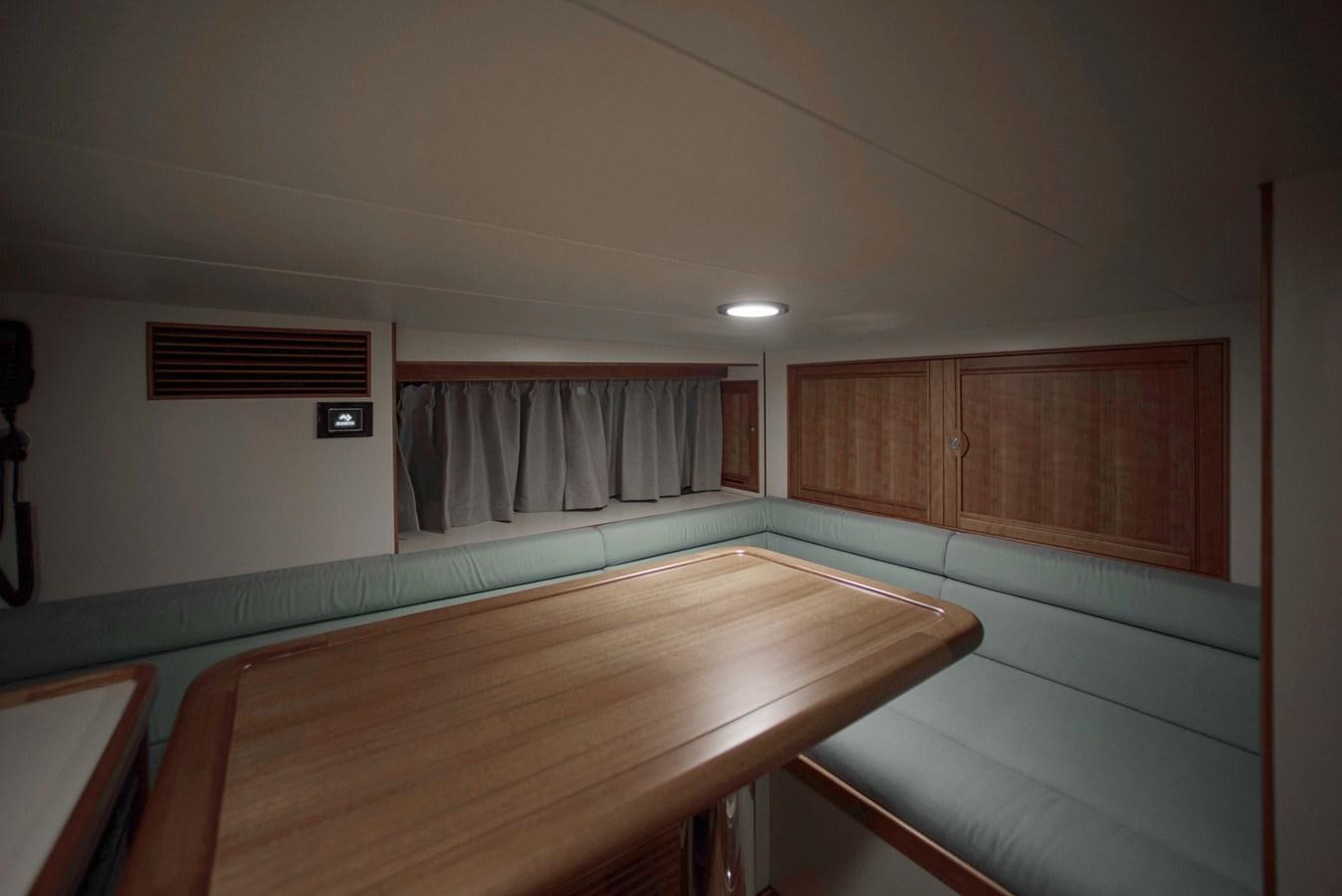 a room with a table and chairs aboard MAGIC Yacht for Sale