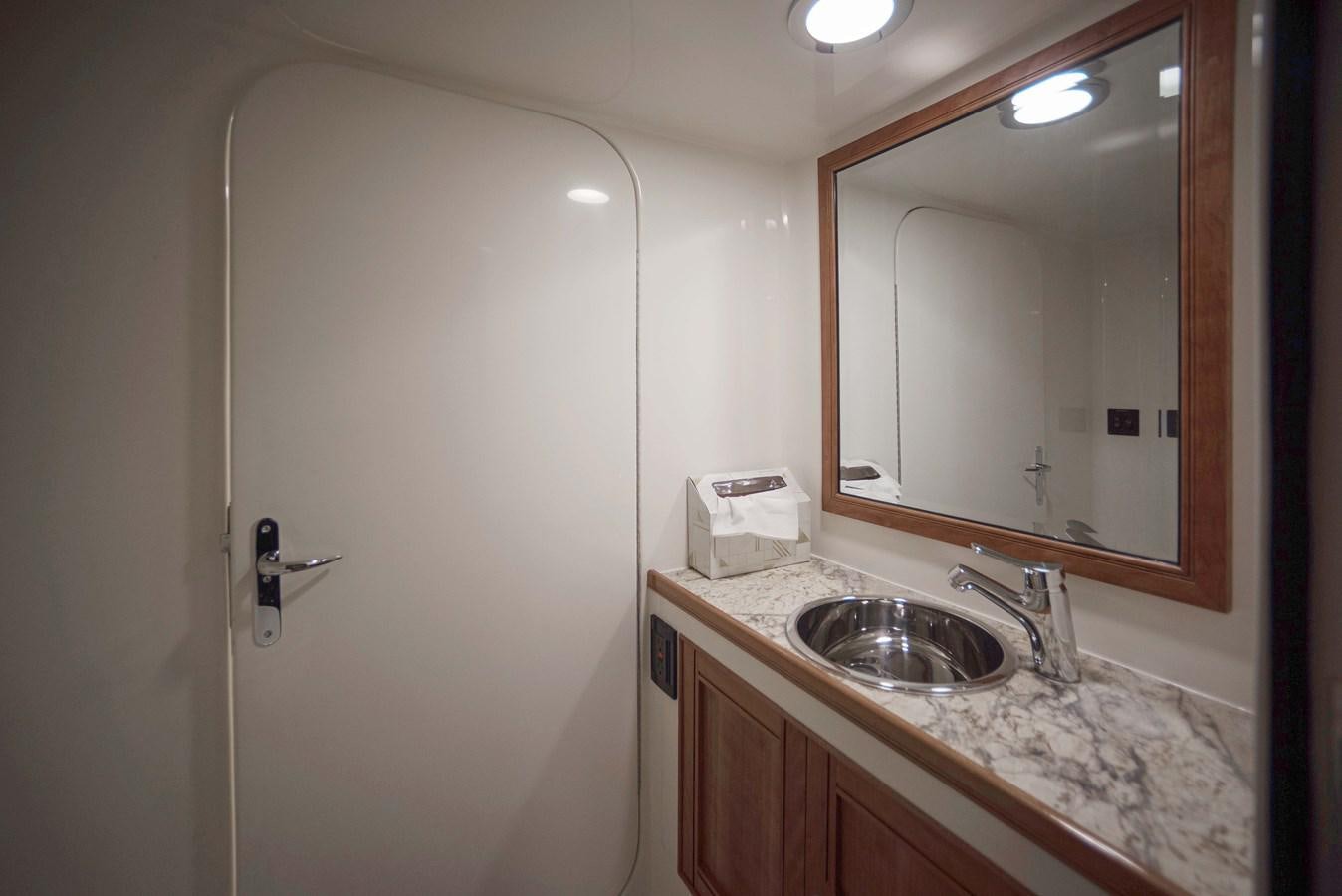 a bathroom with a sink and mirror aboard MAGIC Yacht for Sale
