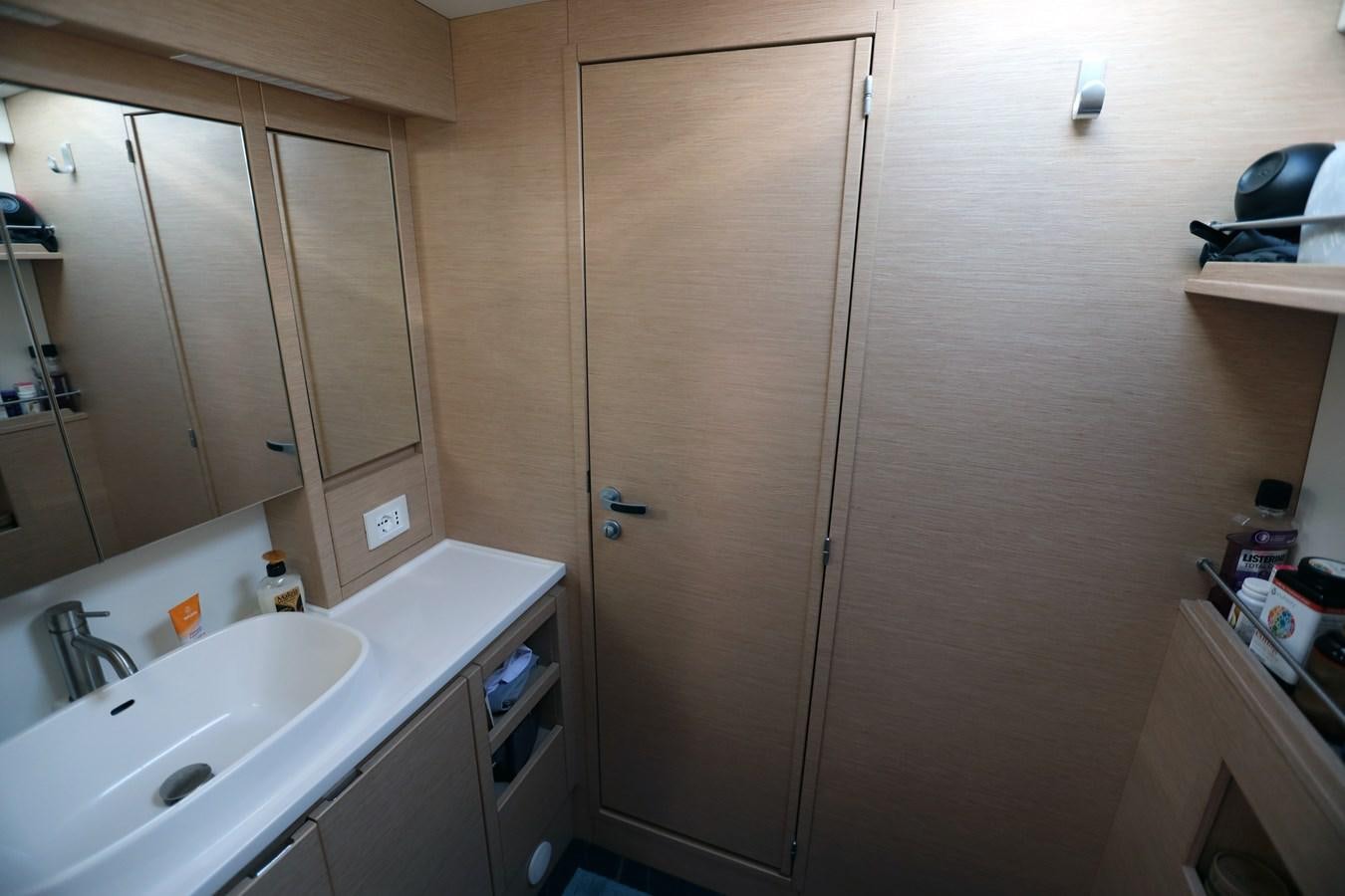 a kitchen with a wood cabinet aboard ELSSA Yacht for Sale