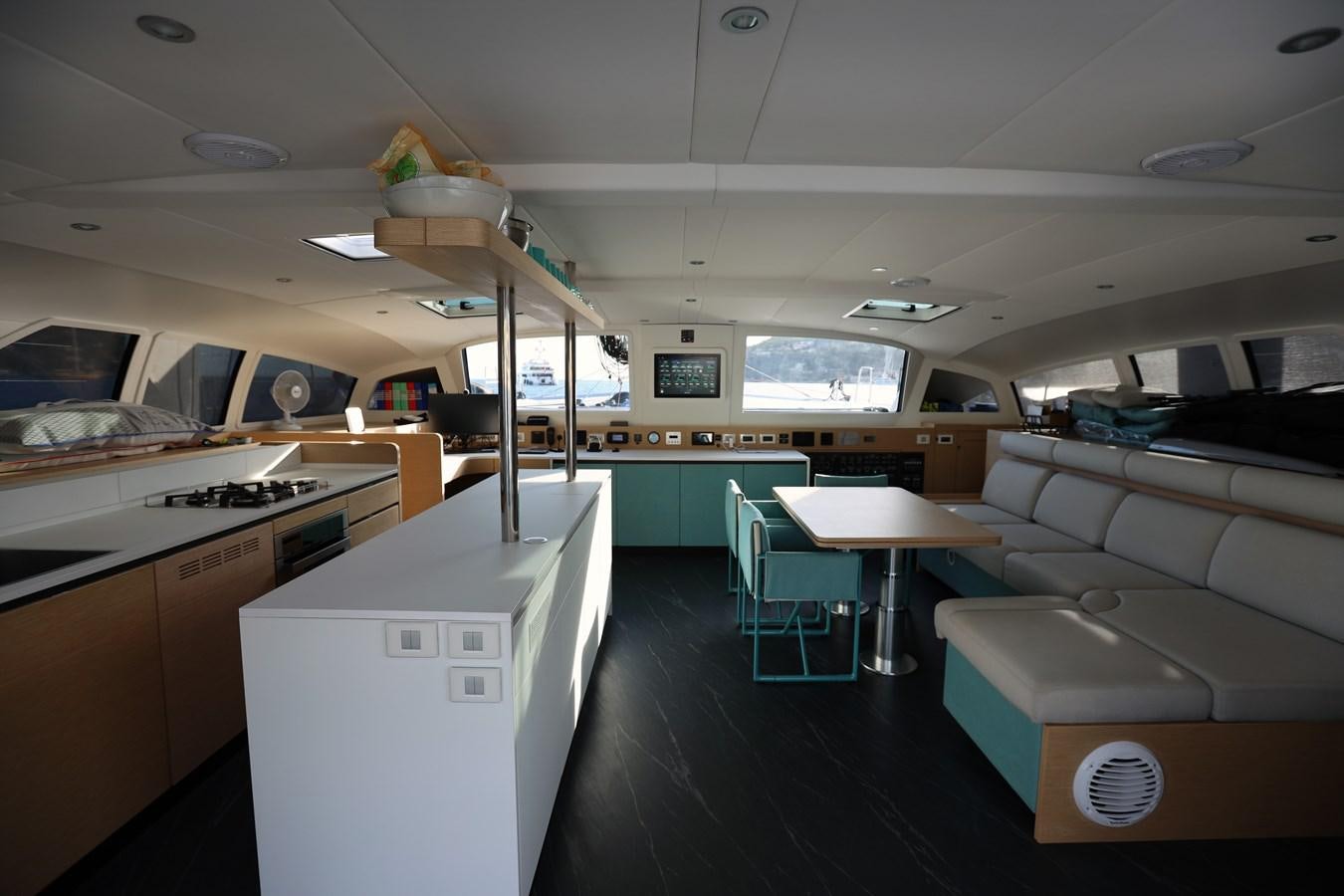 a room with tables and chairs aboard ELSSA Yacht for Sale