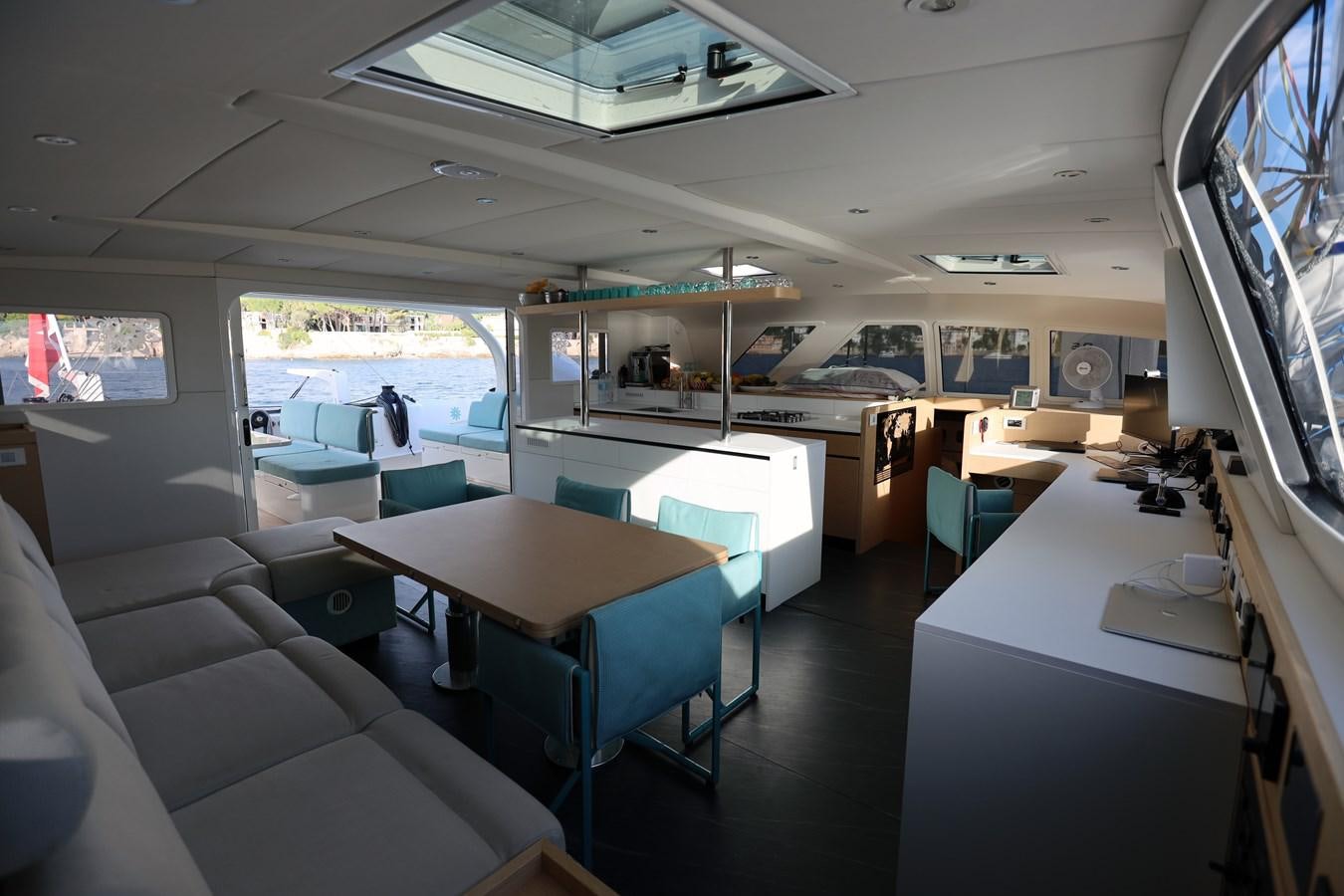 a room with tables and chairs aboard ELSSA Yacht for Sale