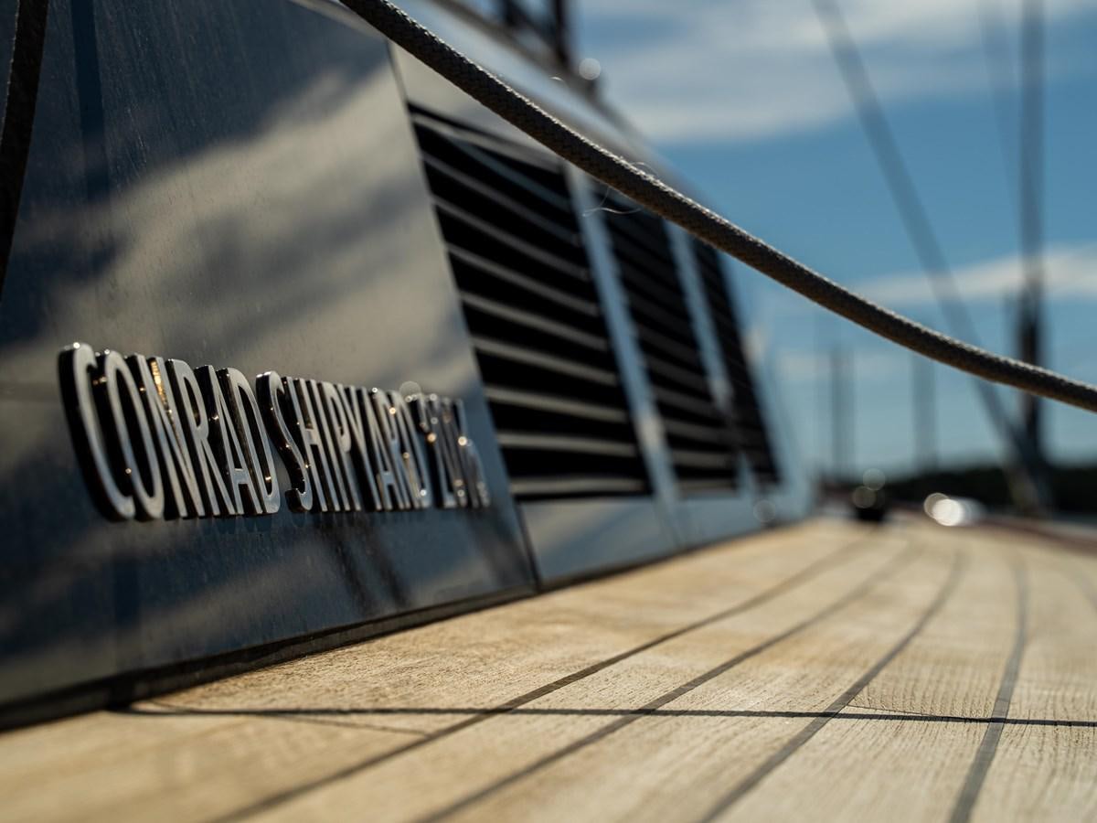 a guitar on a wooden surface aboard BELKARA Yacht for Sale