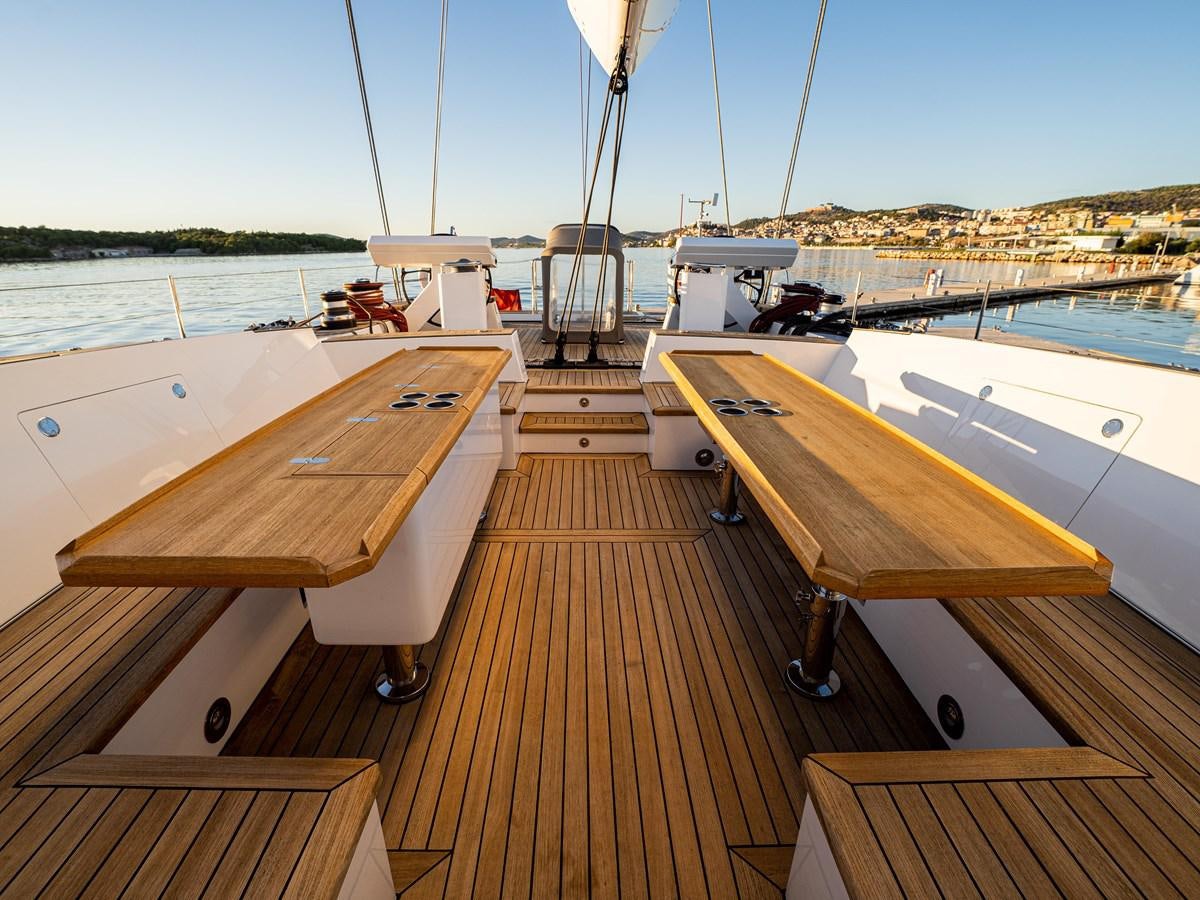 a deck with a deck and a boat on it aboard BELKARA Yacht for Sale