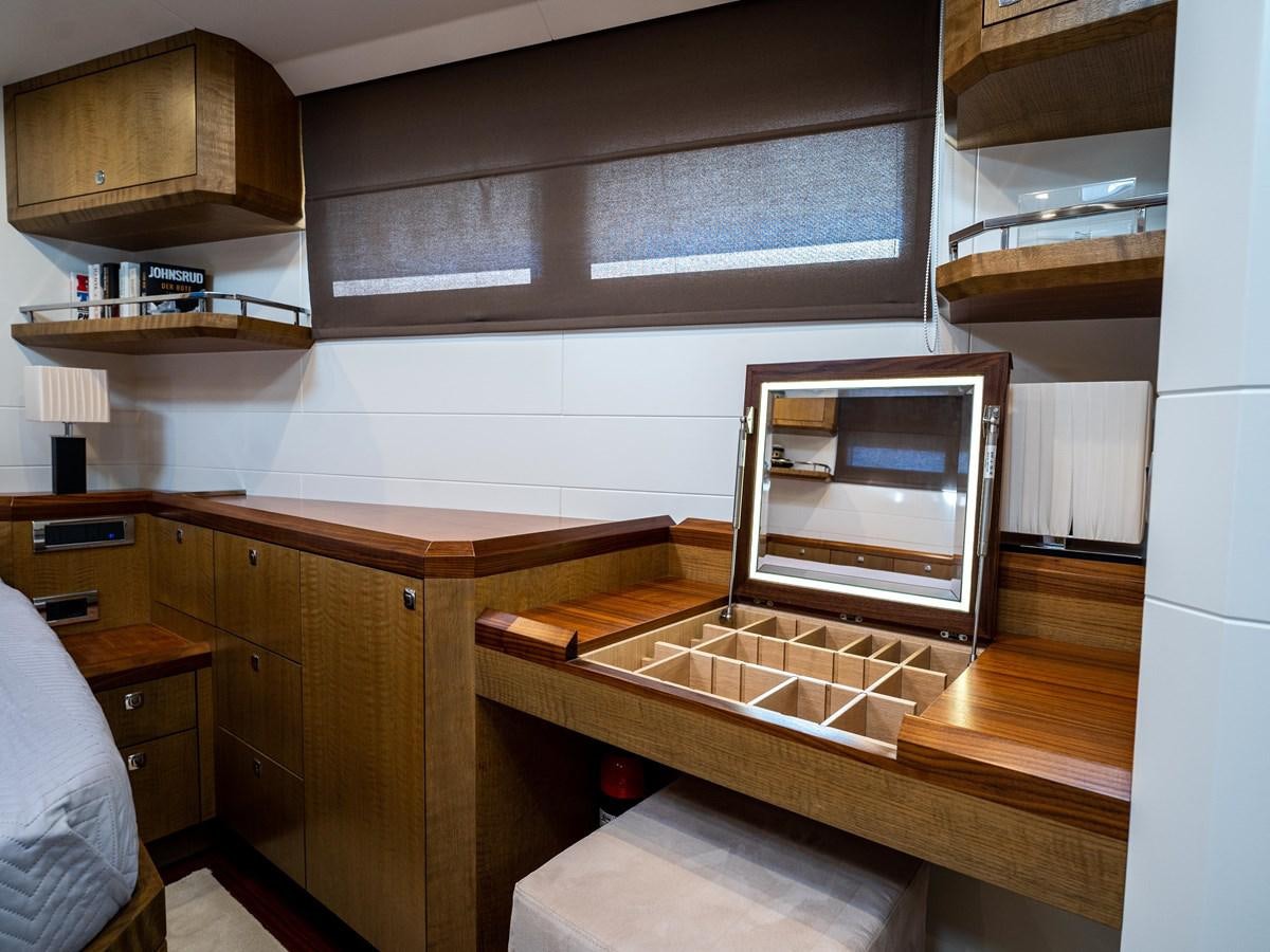 a kitchen with wooden cabinets aboard BELKARA Yacht for Sale
