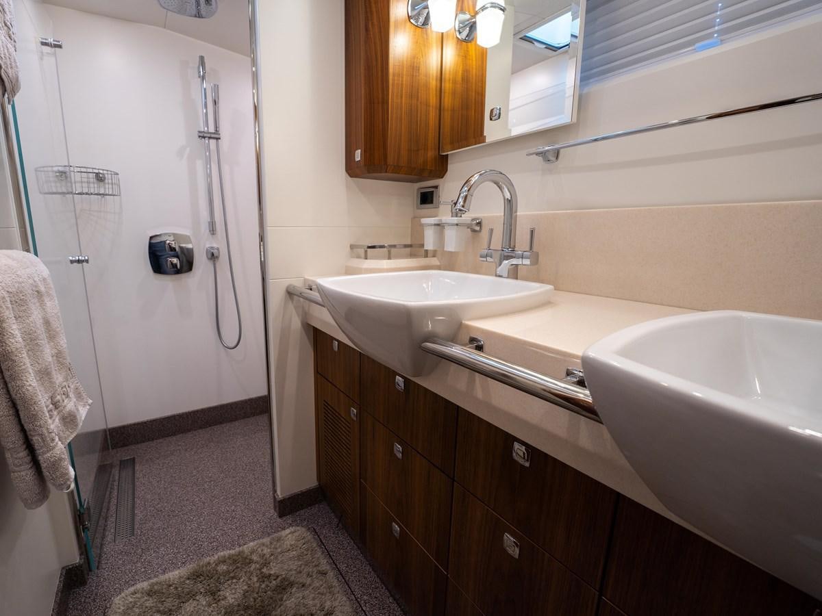 a bathroom with a sink and a shower unit aboard BELKARA Yacht for Sale