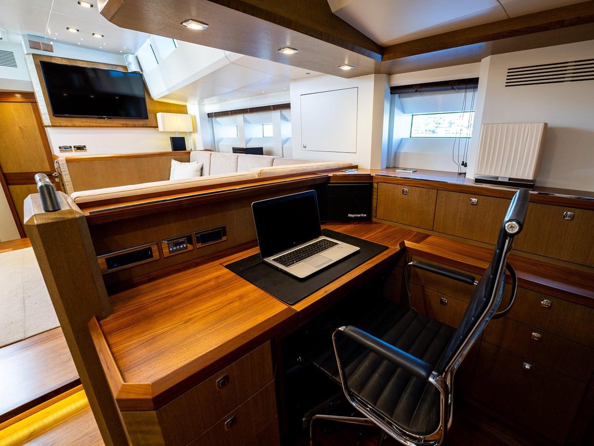 a room with a desk and a computer aboard BELKARA Yacht for Sale