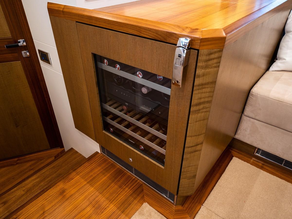 a wood cabinet with a stove aboard BELKARA Yacht for Sale