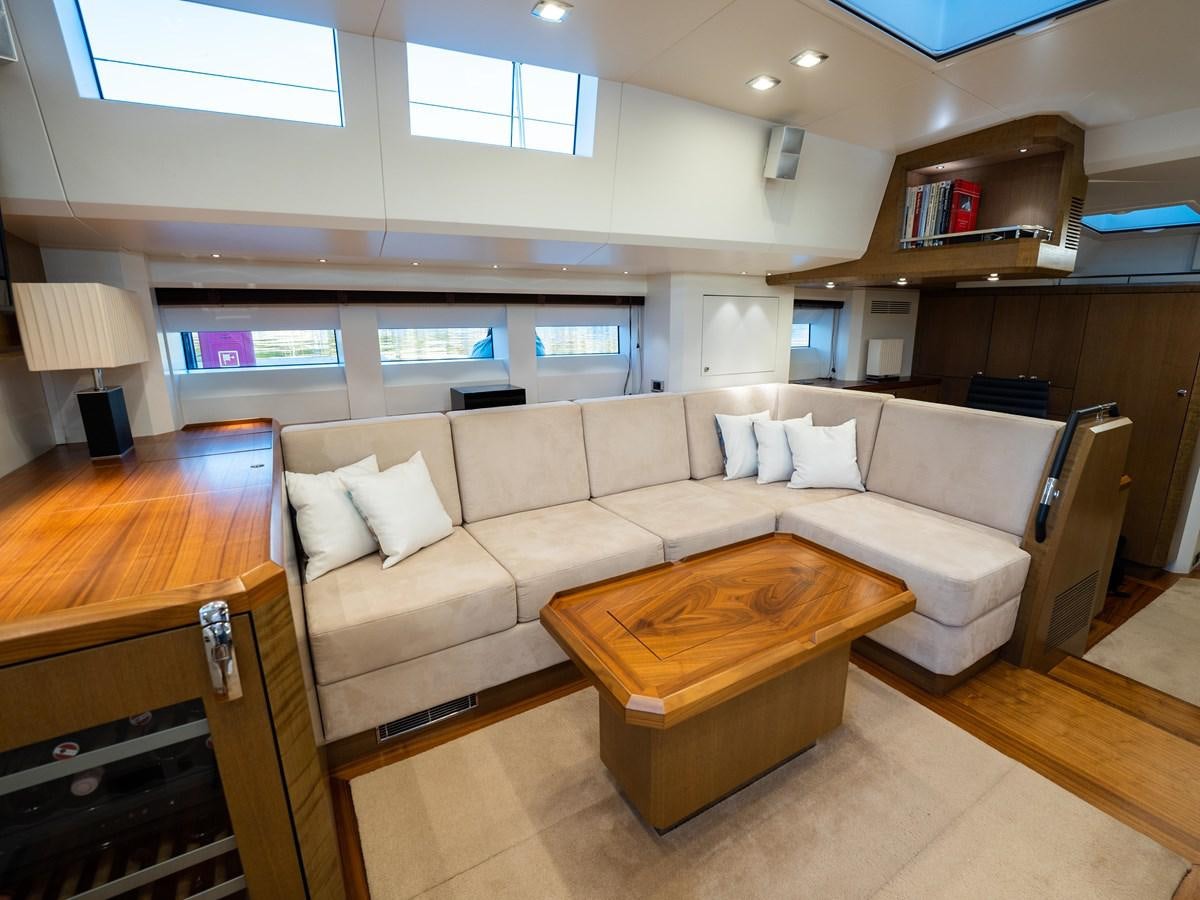 a living room with a couch and a table aboard BELKARA Yacht for Sale