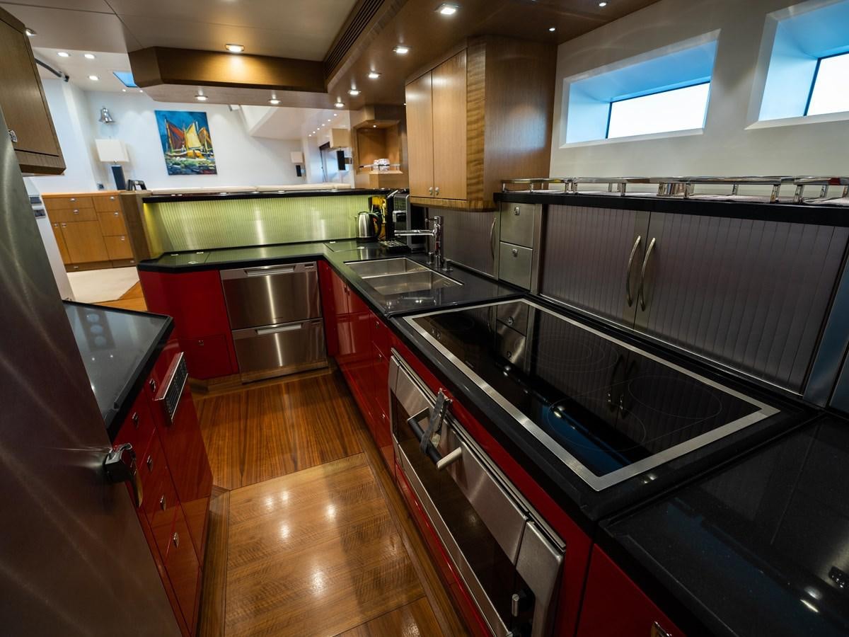 a kitchen with a large island aboard BELKARA Yacht for Sale