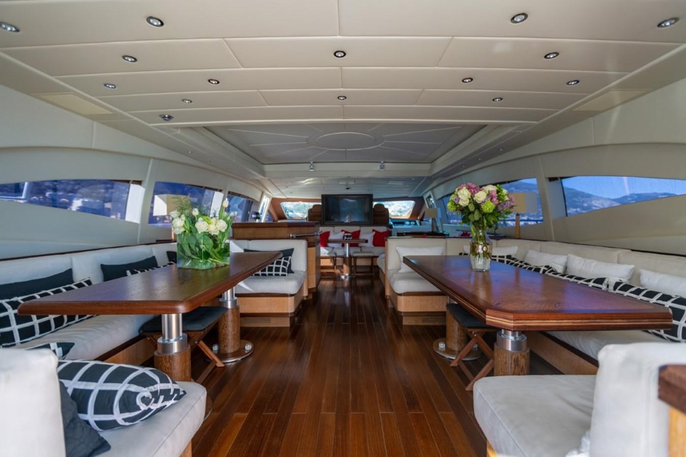 a room with a table and chairs aboard BELISA Yacht for Sale