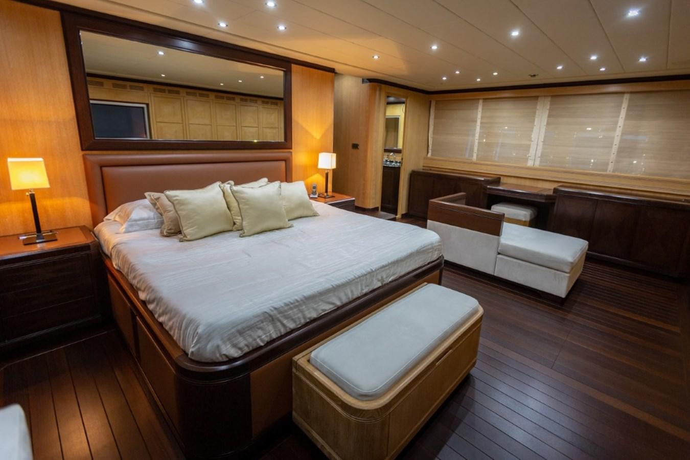 a hotel room with a bed and a couch aboard BELISA Yacht for Sale