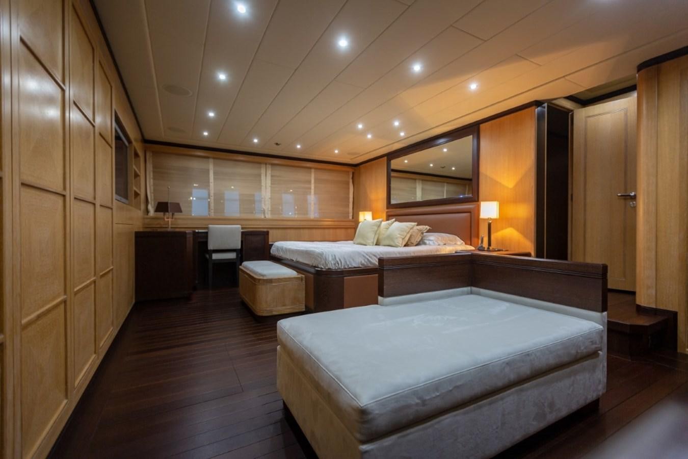 a room with a bed and a desk aboard BELISA Yacht for Sale
