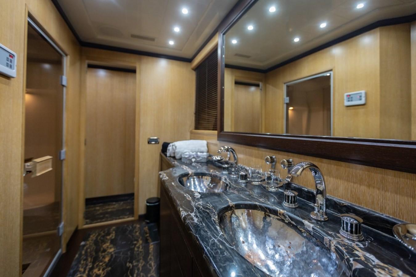 a bathroom with a marble counter top aboard BELISA Yacht for Sale