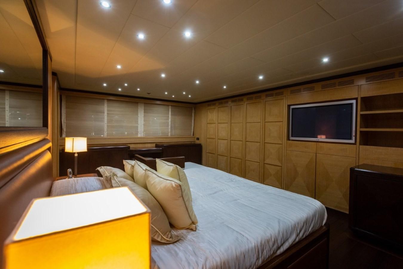 a hotel room with a bed and a tv aboard BELISA Yacht for Sale