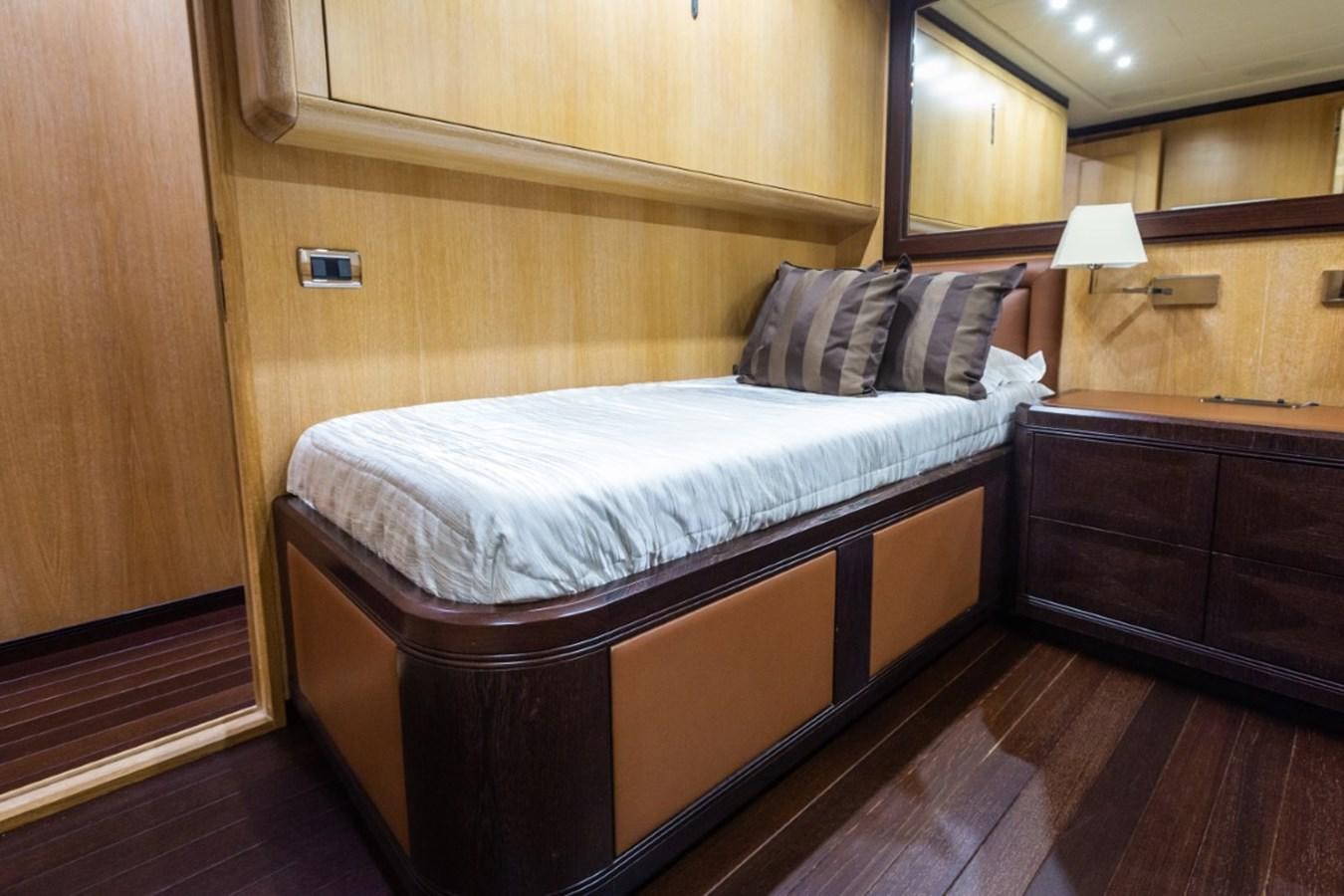 a bed in a room aboard BELISA Yacht for Sale