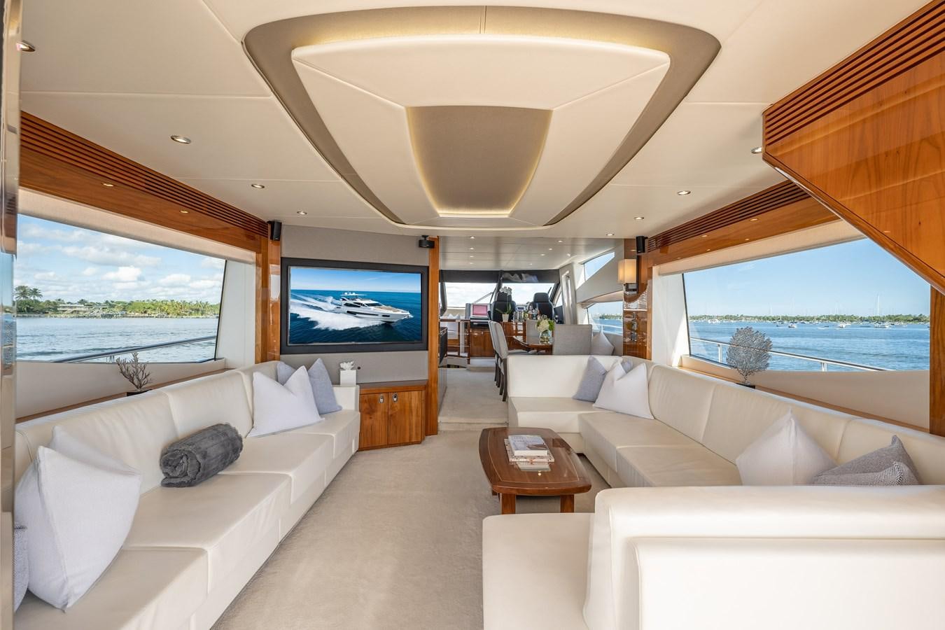 a living room with a large window aboard GOLDEN OURS Yacht for Sale