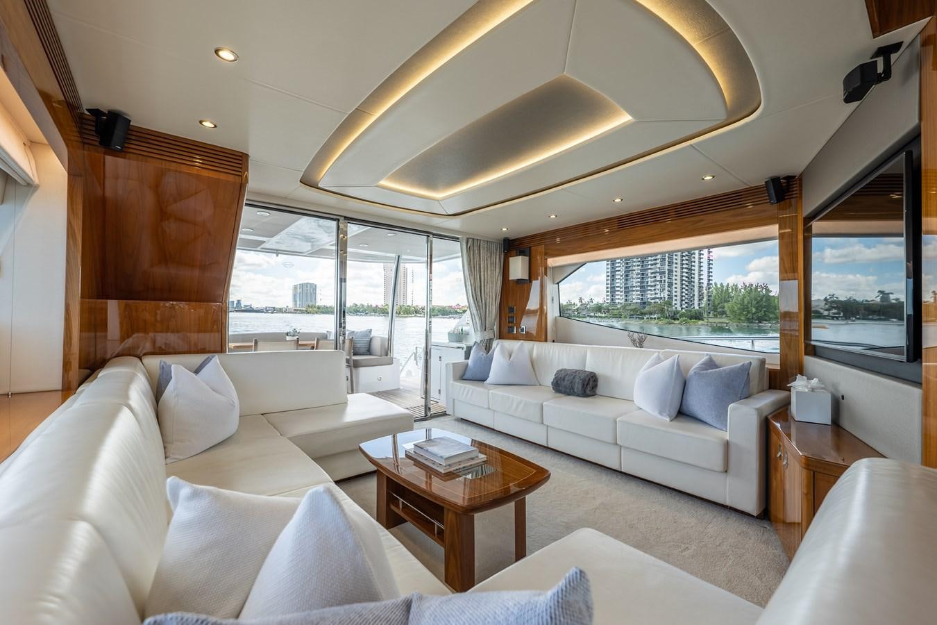 a living room with a large window aboard GOLDEN OURS Yacht for Sale