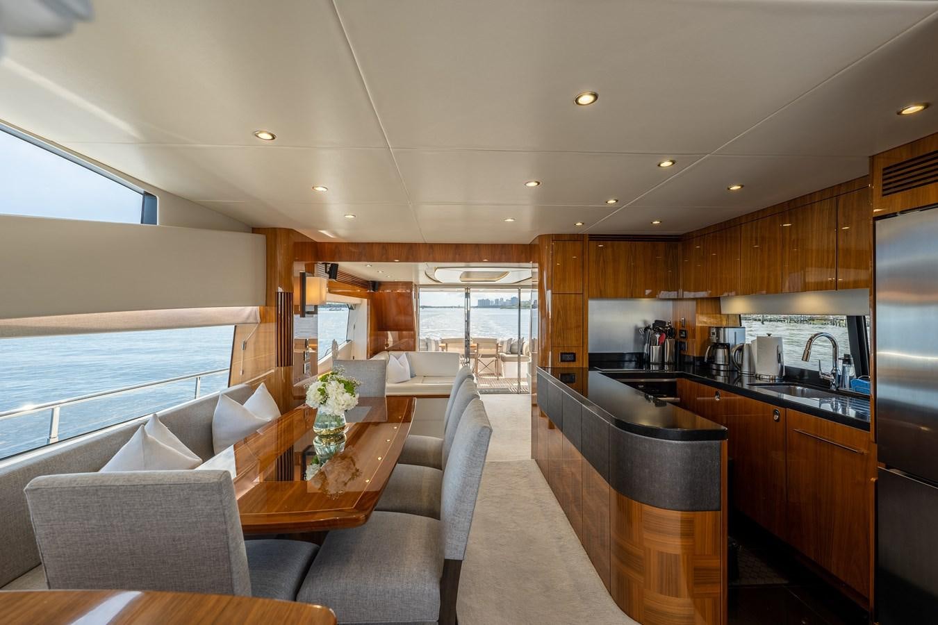 a kitchen and dining area aboard GOLDEN OURS Yacht for Sale
