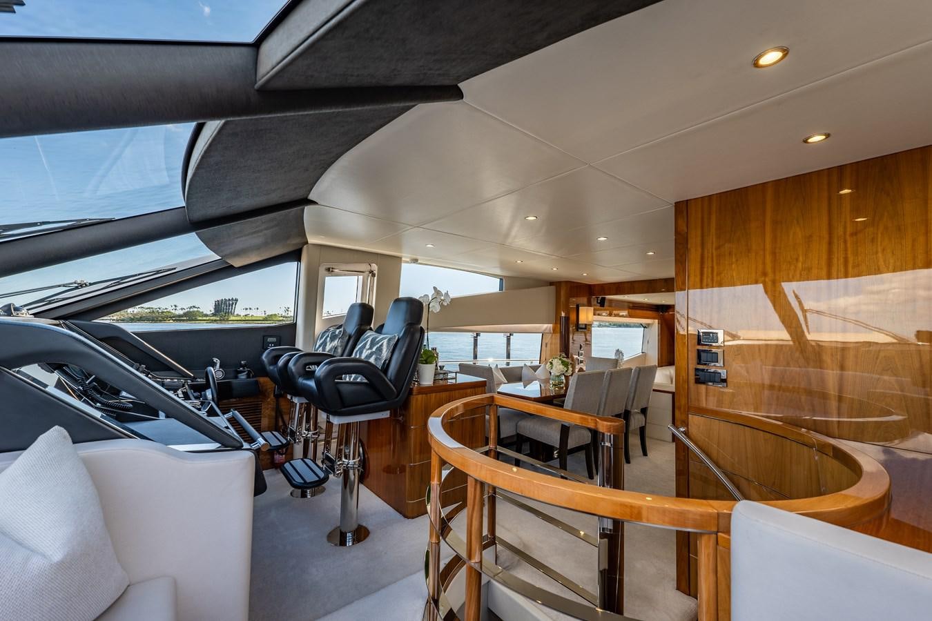 a boat with a table and chairs aboard GOLDEN OURS Yacht for Sale