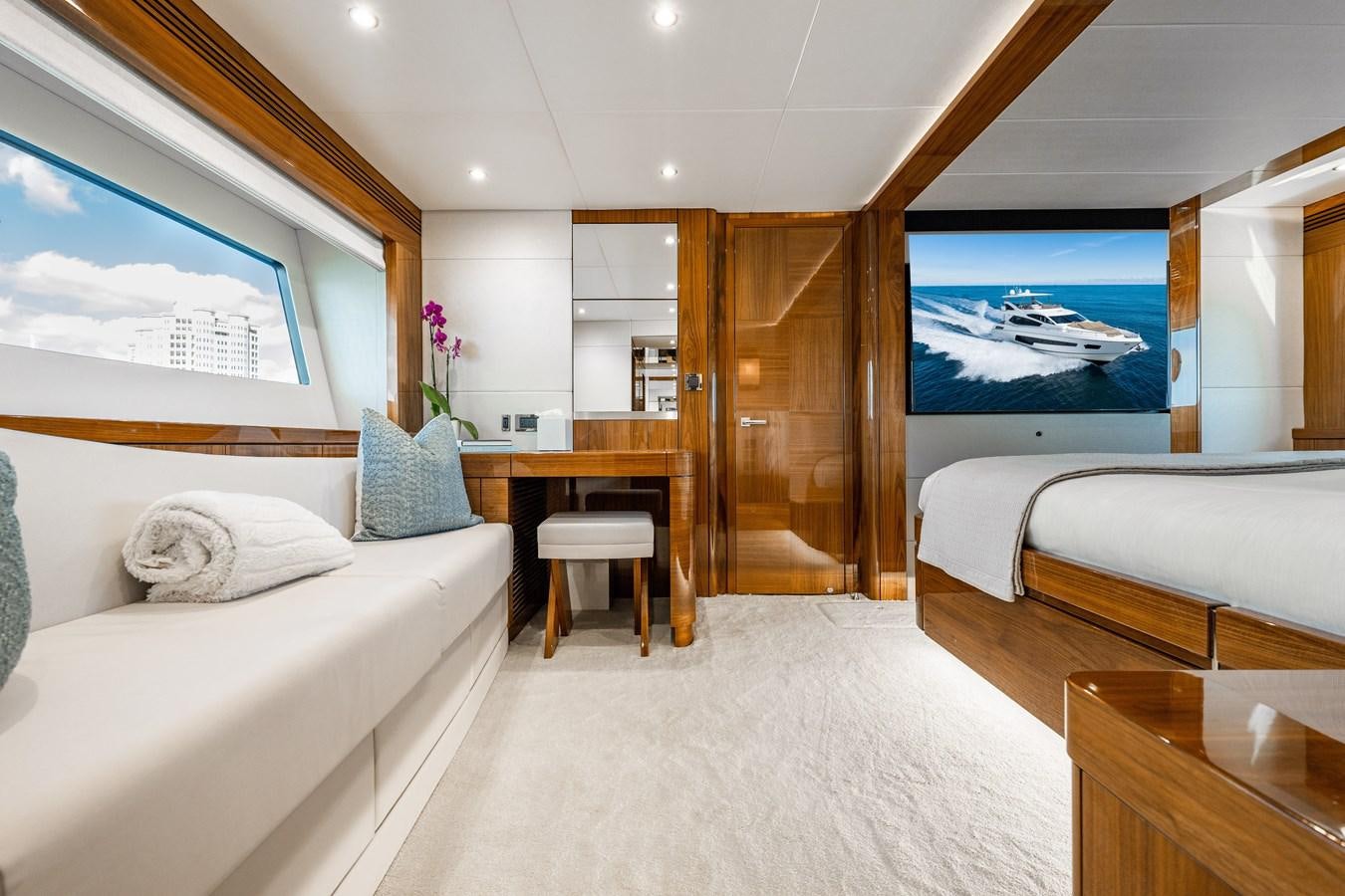a room with a bed and a desk aboard GOLDEN OURS Yacht for Sale