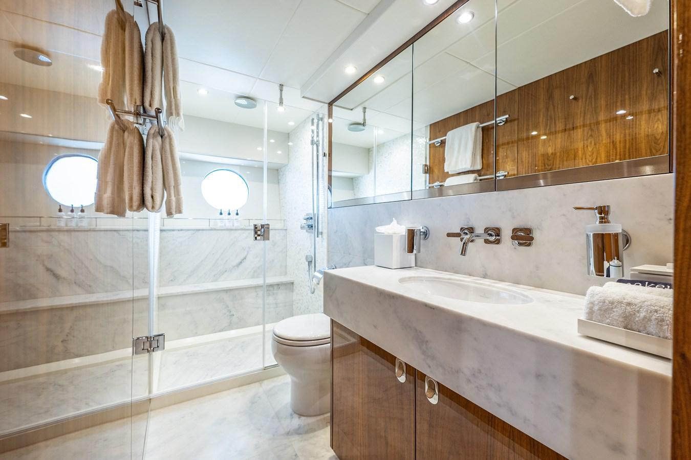 a bathroom with a large mirror aboard GOLDEN OURS Yacht for Sale