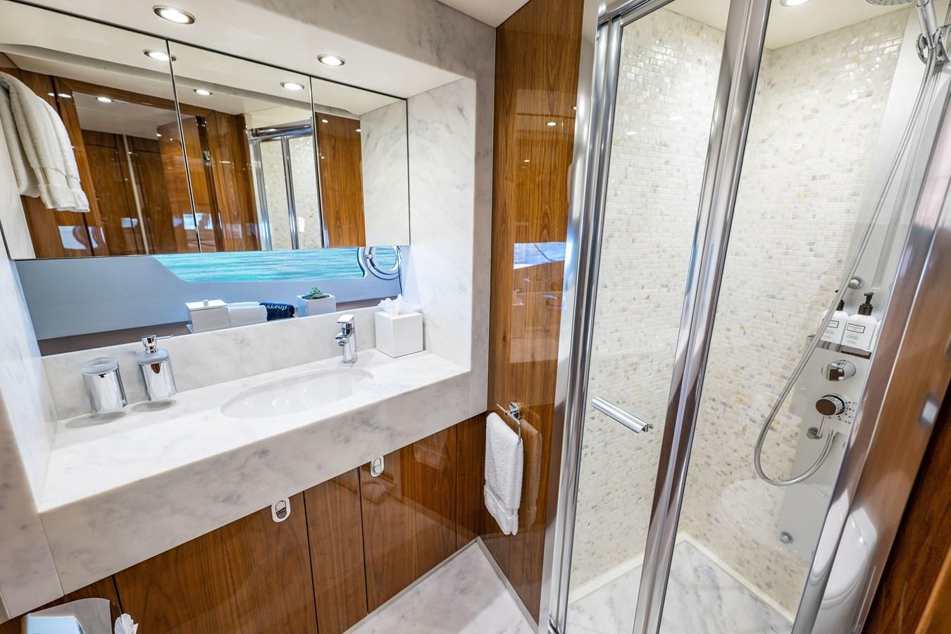 a bathroom with a large mirror aboard GOLDEN OURS Yacht for Sale