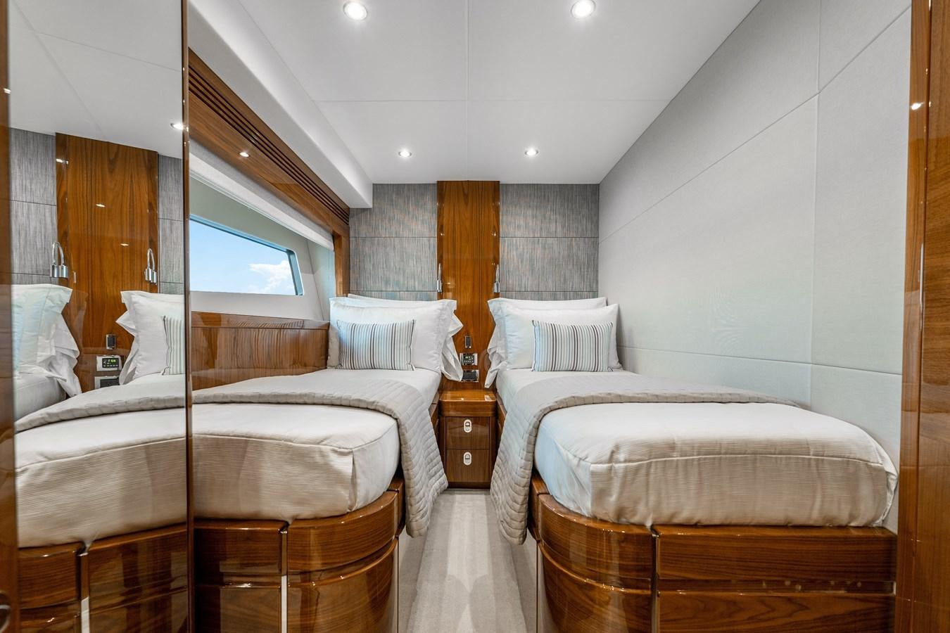 a room with a couple of beds aboard GOLDEN OURS Yacht for Sale