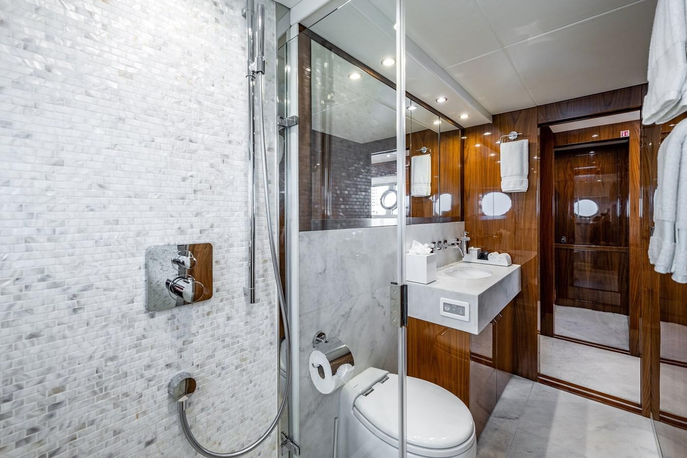 a bathroom with a glass shower aboard GOLDEN OURS Yacht for Sale