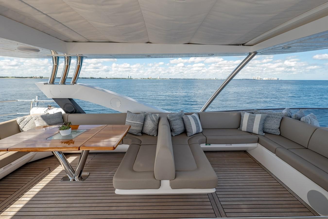 a couch and table on a boat aboard GOLDEN OURS Yacht for Sale