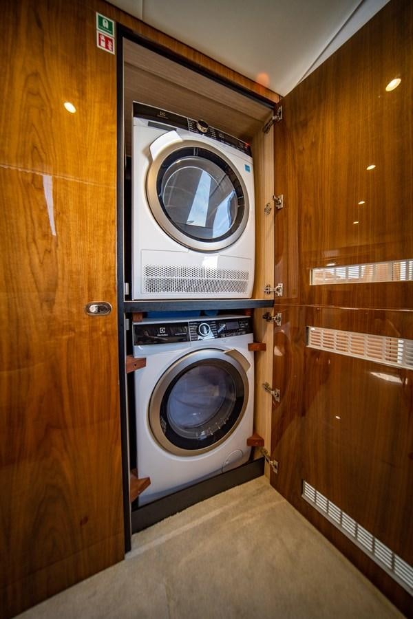 a washer and dryer in a room aboard GOLDEN OURS Yacht for Sale