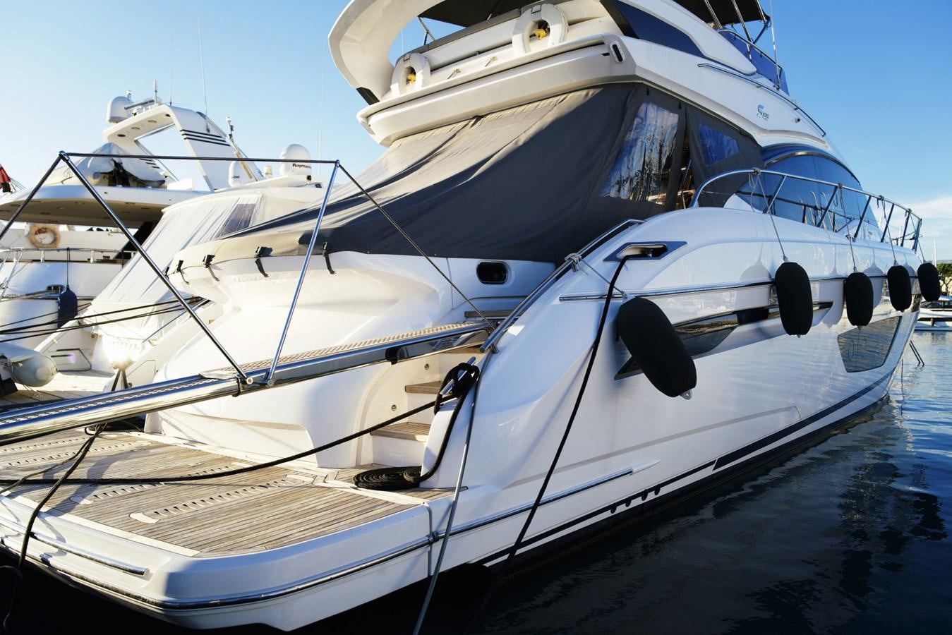 a couple of boats on a dock aboard PRINCESS S65 Yacht for Sale