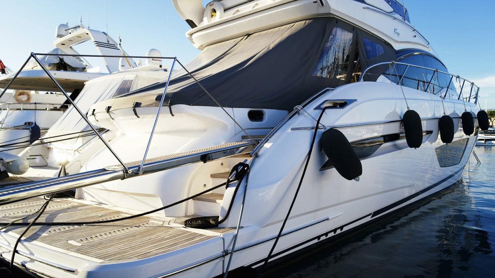 a couple of boats on a dock aboard PRINCESS S65 Yacht for Sale
