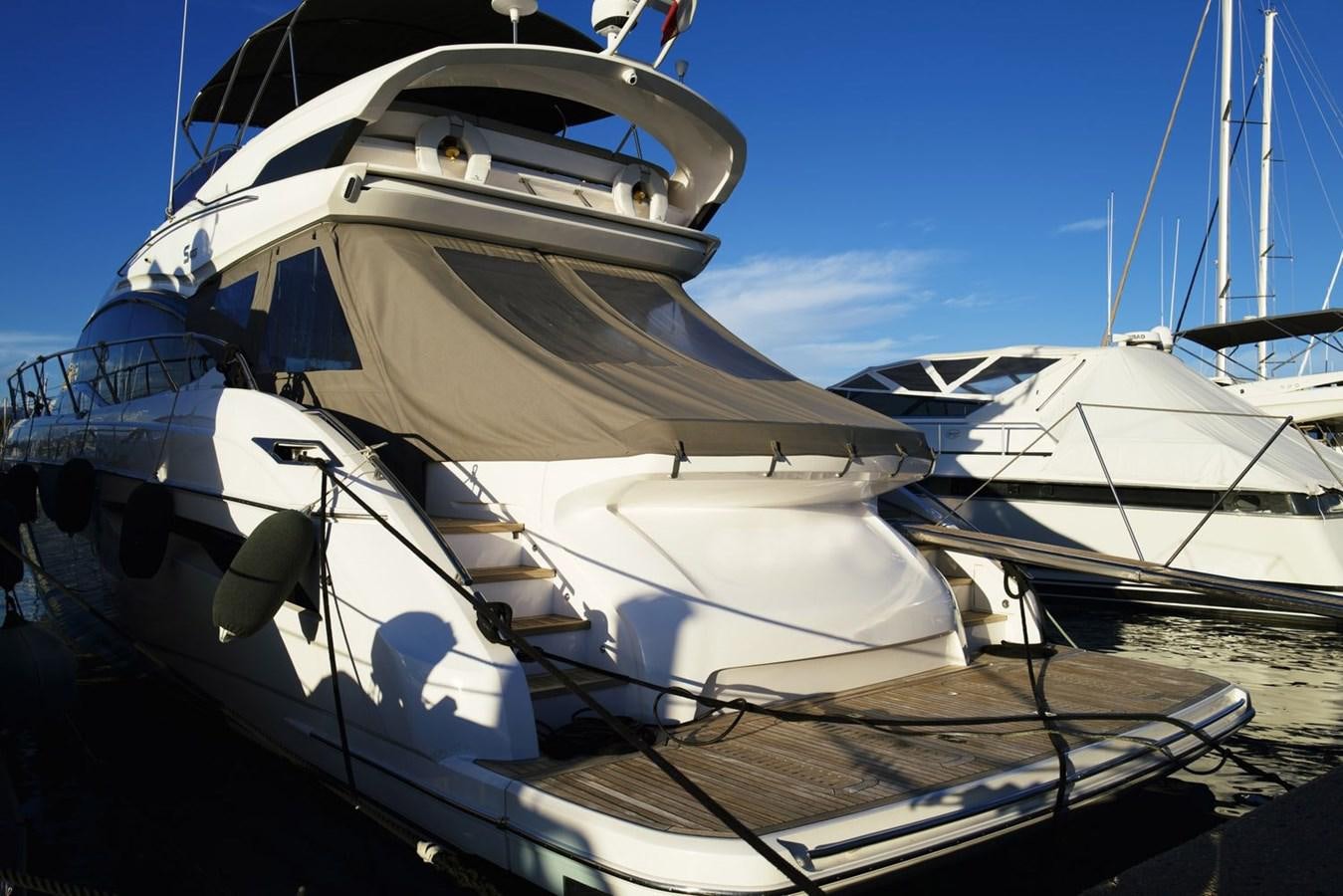 a couple of boats are parked in a harbor aboard PRINCESS S65 Yacht for Sale