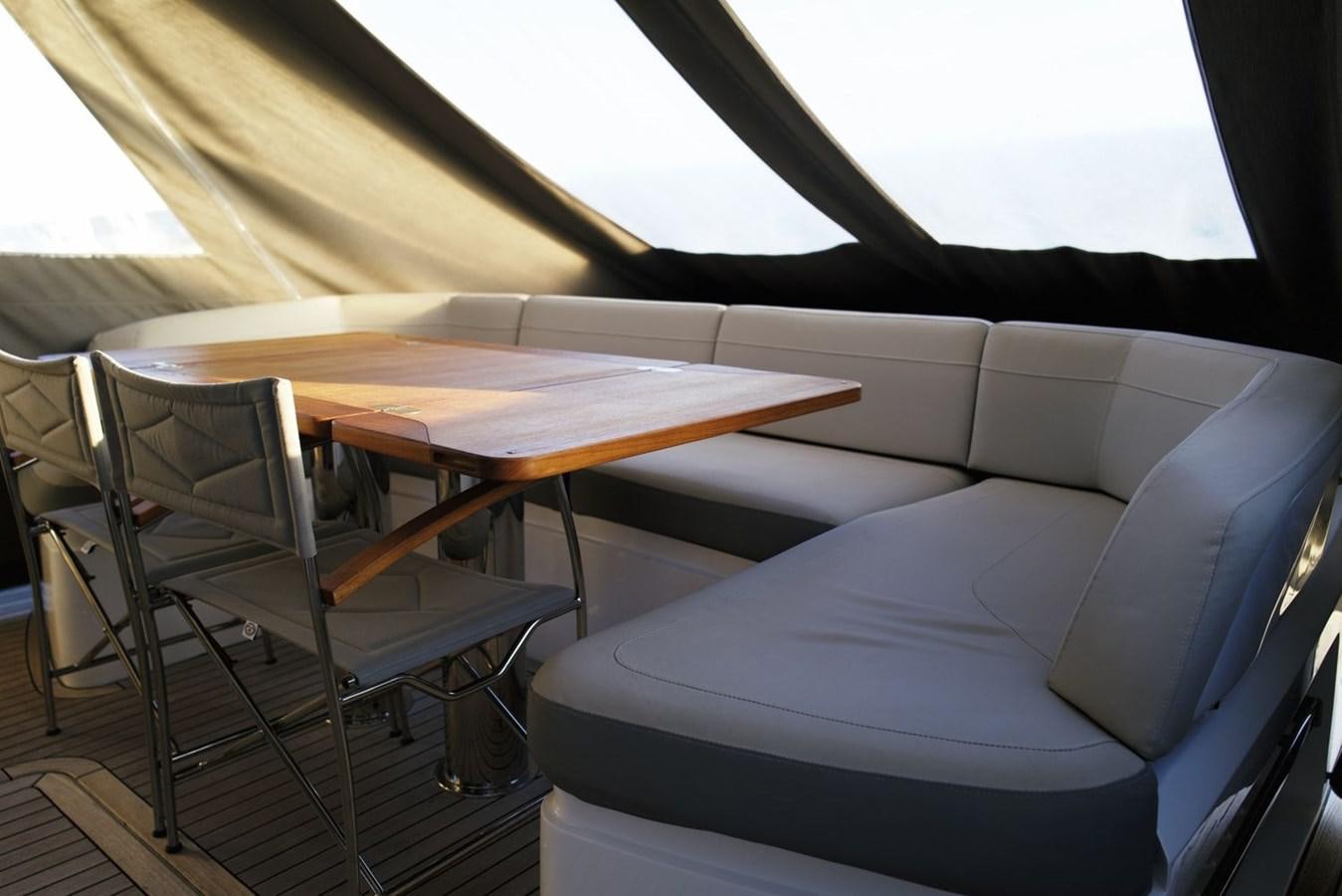 a table and chairs in a tent aboard PRINCESS S65 Yacht for Sale