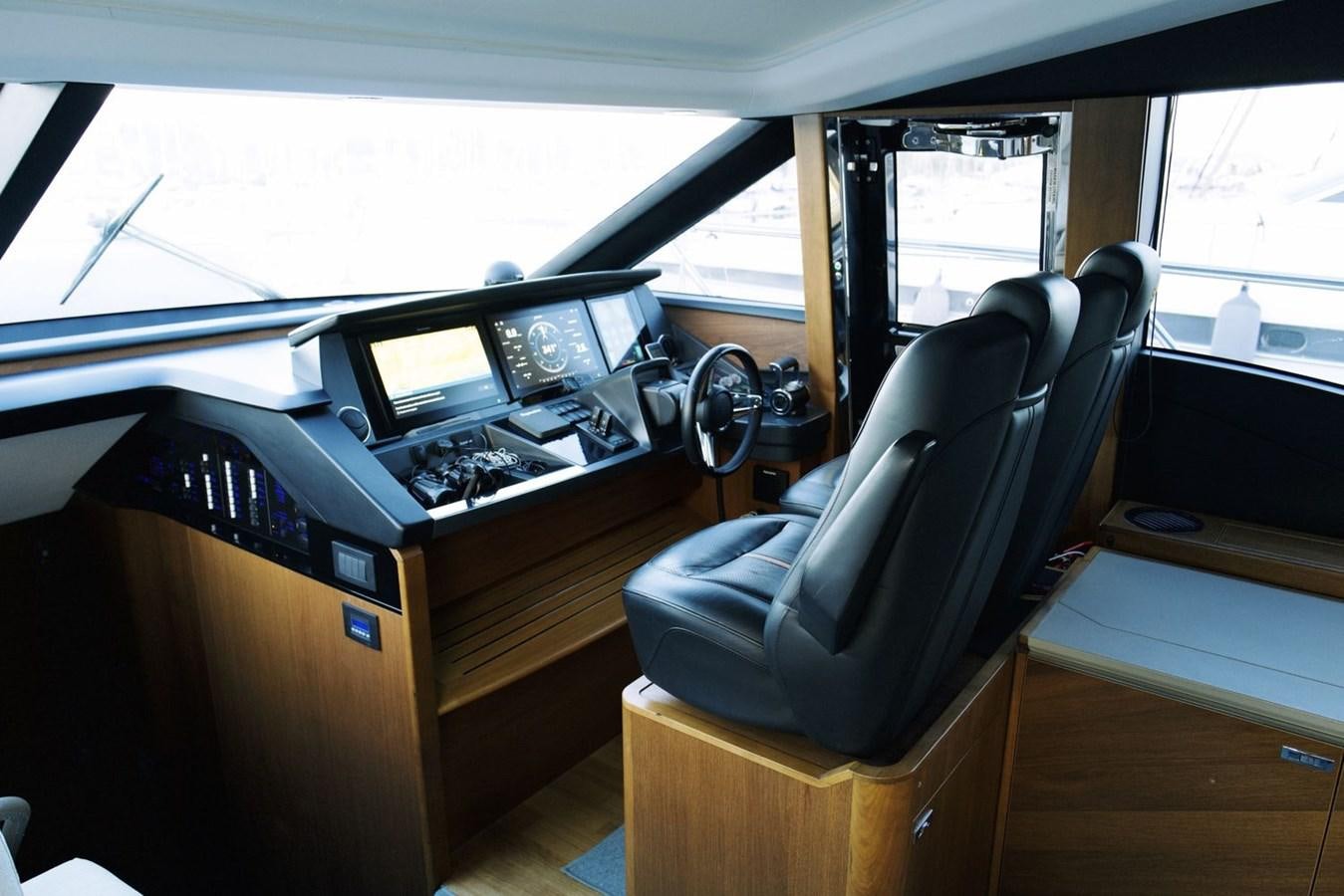 a room with computers and monitors aboard PRINCESS S65 Yacht for Sale