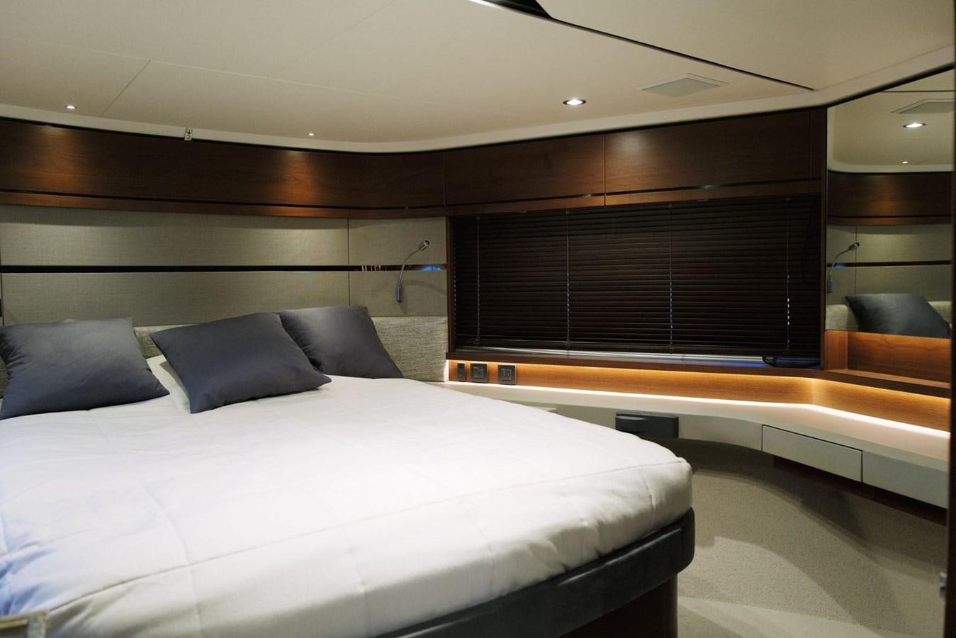 a room with a bed and a couch aboard PRINCESS S65 Yacht for Sale