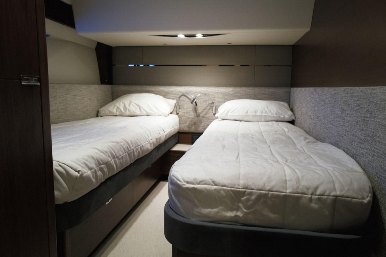 a couple of beds in a room aboard PRINCESS S65 Yacht for Sale