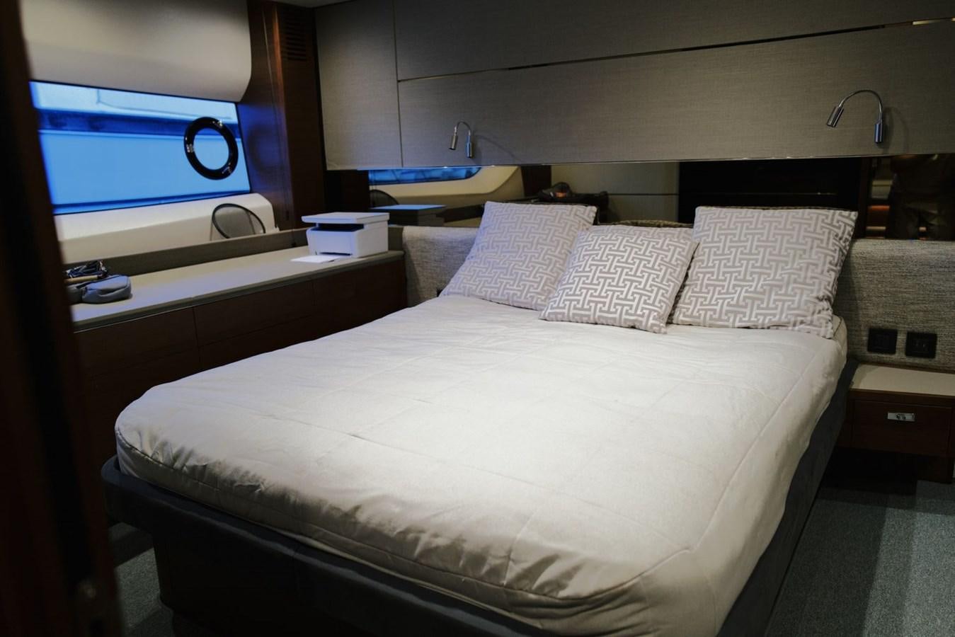 a bedroom with a bed and a television aboard PRINCESS S65 Yacht for Sale