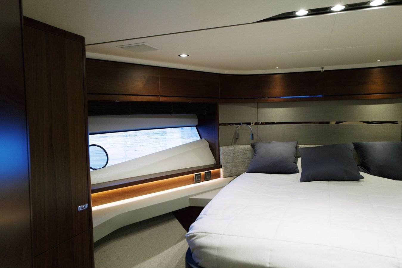 a bed in a room aboard PRINCESS S65 Yacht for Sale