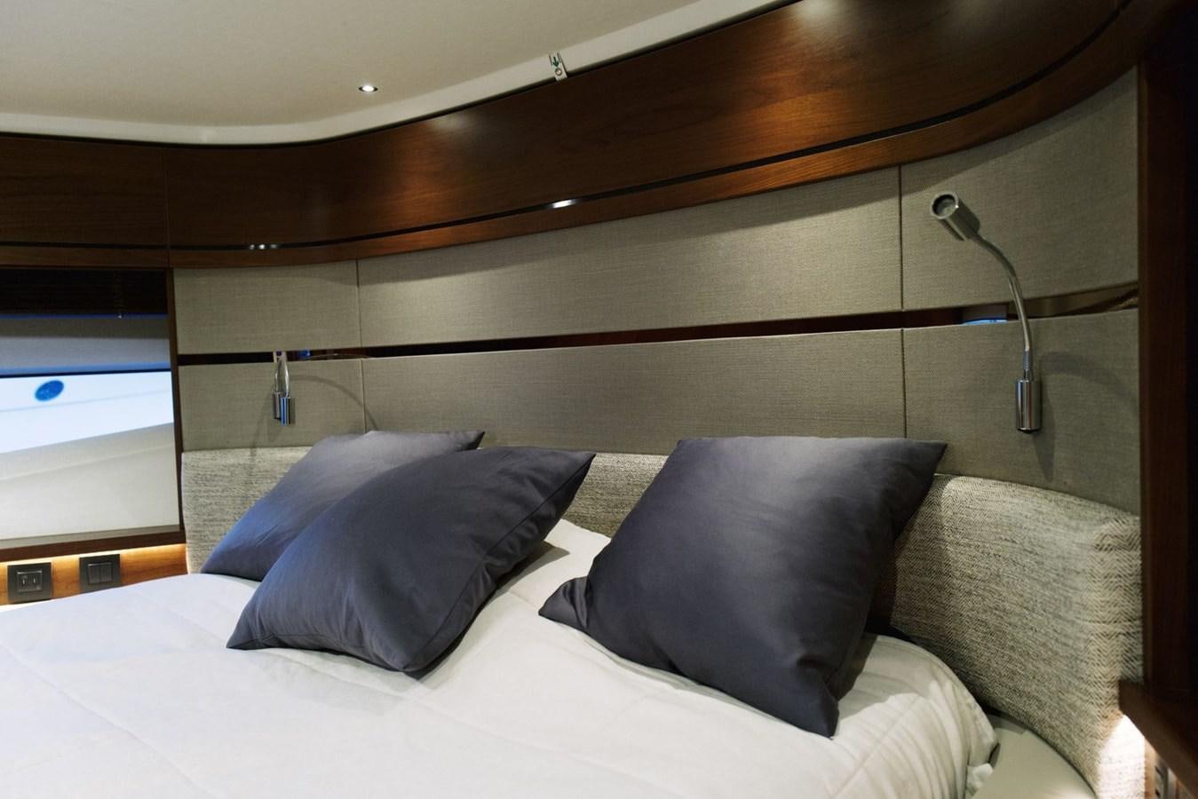 a bed with pillows aboard PRINCESS S65 Yacht for Sale
